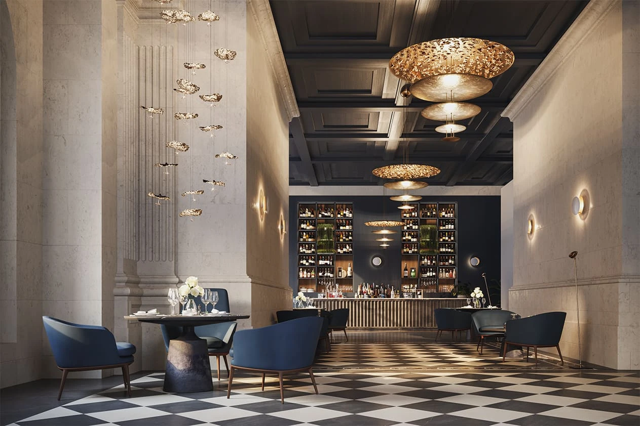 Goldene Catellani & Smith Pendelleuchten Gold Moon über der Bar eines Hotels
